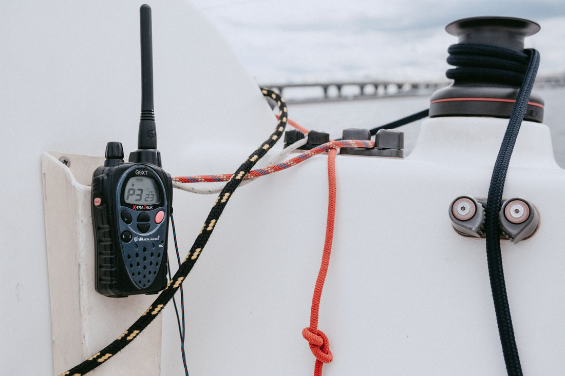 Handheld push-to-talk radio in use outdoors